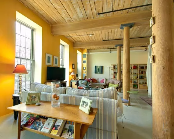 Renaissance on the River open loft space with exposed brick, post and beams,